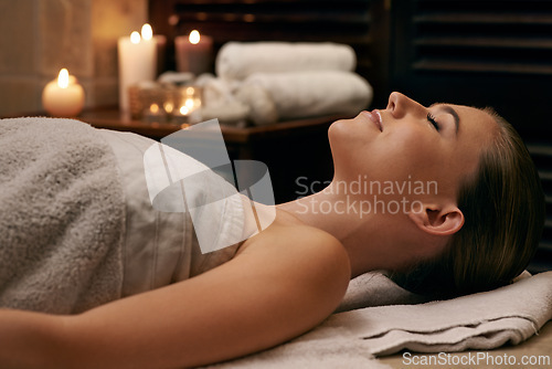 Image of Woman, luxury and spa with calm, zen and rest for relaxation and stress relief. Person, treatment and wellness for self care, health and massage parlour for happiness and beauty with serenity