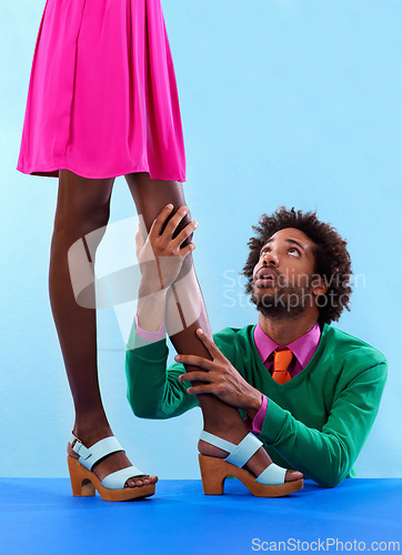 Image of Couple, studio and retro with color, fashion and love with relationship and begging. African man, woman and dating with funky, vivid and bright contrast with breakup or confession on blue background