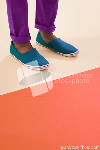 Image of Male model, shoes and footwear for fashion, floor and feet with mock up space and colourblock background. Contemporary, stylish and trendy for black man person, classic or comfortable sneaker design