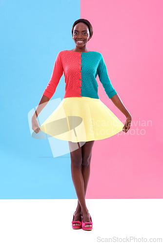 Image of Fashion, studio or portrait of black woman with colorful, trendy and stylish outfit with smile. Unique, different and happy African model with edgy, classy and retro style on pink and blue background