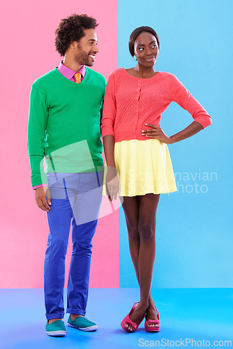 Image of Fashion, happy and young black couple in studio with colorful, trendy and stylish outfit. Smile, love and full body of confident African man and woman with edgy, classy and retro style by background.