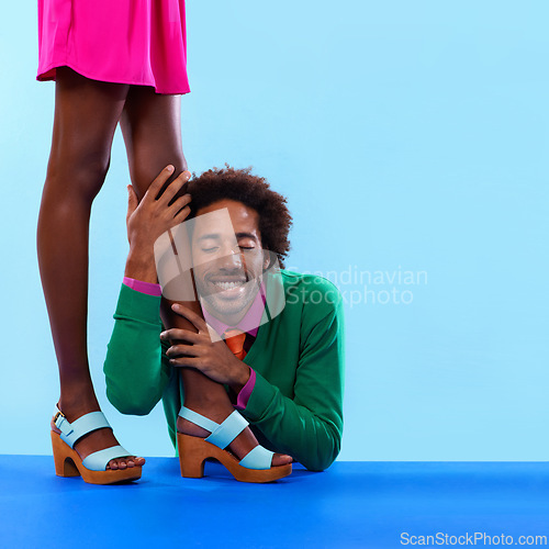 Image of Couple, studio and smile with color, fashion and love with relationship and begging. African man, woman and dating with funky, vivid and bright worship with vintage or confession on blue background