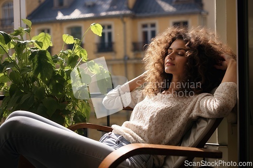 Image of Relaxing Woman Enjoying Sunlight on Cozy Balcony