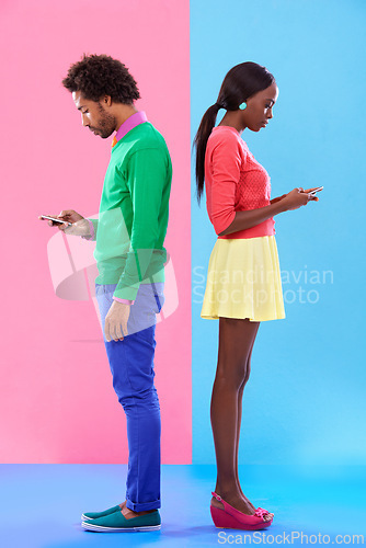 Image of Couple, texting and phone in colorful clothes for fashion, dating or new love with crush. African people, young and serious for message on cell for flirting, conversation and chatting together