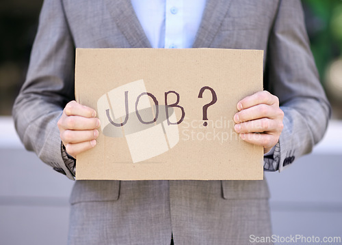 Image of Jobless, cardboard and person with suit, outdoor and adult with unemployment with poverty. Employee, search and hunting for work with sign on street in city of Cape Town for career opportunity