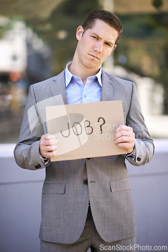 Image of Poster, jobless and stress for man with suit, outdoor and adult with unemployment with poverty. Male person, search and hunting for work with cardboard sign on street in city of Cape Town for career