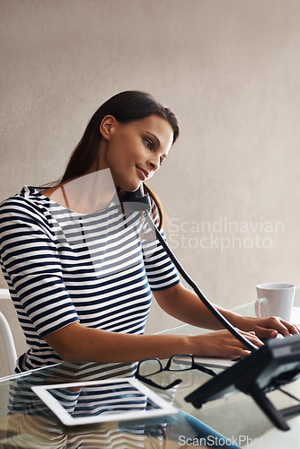 Image of Woman, phone call or typing in office, reception or desk for message, crm or feedback in Vancouver. Female person, receptionist or consultant for b2b, contact and sale in telemarketing business