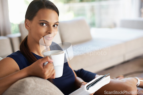Image of Portrait, drinking coffee and woman reading book in home to relax, education or learning at breakfast in the morning. Novel, tea cup or face of person with espresso, latte and study on sofa in lounge