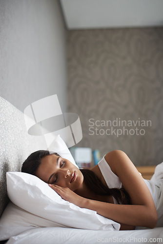 Image of Woman, sleeping and bed for rest, dream and wellness as stress relief in bedroom in Rio de Janeiro. Mental health, female person and eyes closed on pillow for calm, peace and relax for self care