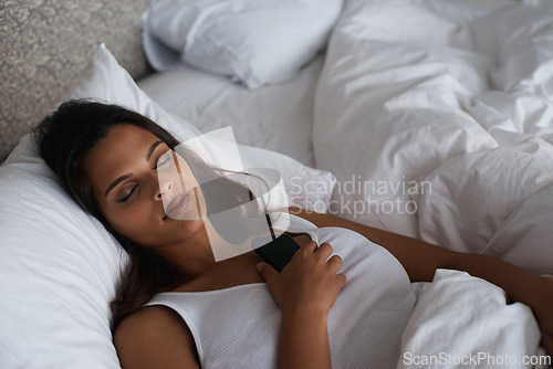 Image of Bedroom, night and woman with phone, sleeping and social media and connection to internet for app. Bed, tired and communication with mobile, digital and female person on dating site with technology