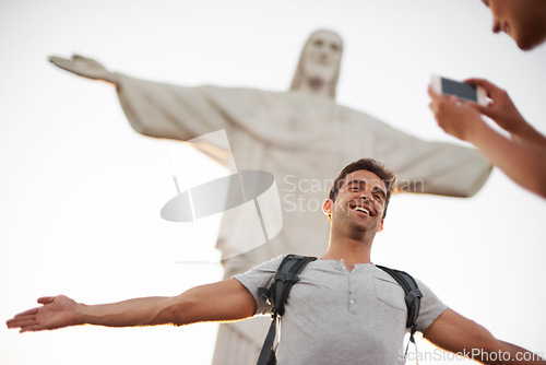 Image of Man, photo and travel by christ the redeemer, crucify and happy in christian culture on vacation. Jesus sculpture, rio or guy for social media update in mobile picture, peace or tourism in brazil