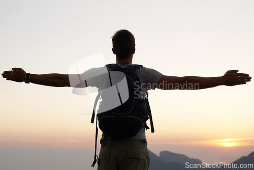 Image of Man, silhouette and freedom with mountain, sunset and adventure for travel or holiday. Tourist, brazil and backpack with sunrise, view and nature for calm and fulfillment with hike for health