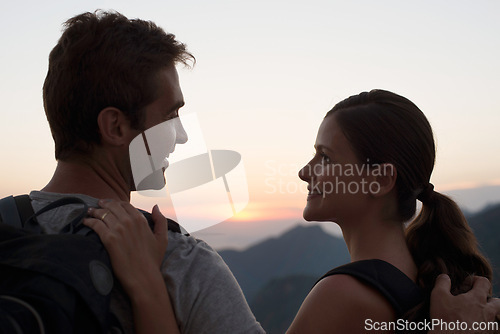 Image of Travel, smile and couple in mountains with view of sky together on holiday or vacation abroad. Love, hiking or backpacking with happy young man and woman outdoor for tourism overseas from back