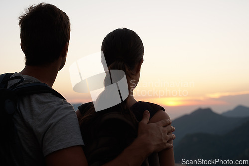 Image of Travel, sunset and couple in mountains with view of sky together on holiday or vacation abroad. Love, hiking or backpacking with man and woman outdoor for tourism or discovery overseas from back