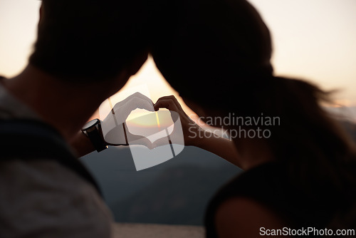 Image of Travel, heart hands and couple in mountains with view of sky together on holiday or vacation abroad. Love, hiking or backpacking with emoji of man and woman outdoor for tourism overseas from back