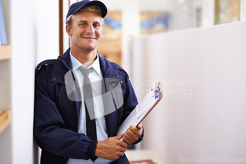 Image of Portrait, smile and delivery with courier man at office for distribution, shipping or service. Ecommerce, logistics or retail and happy young postal worker with clipboard for manifest or order