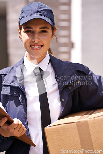 Image of Delivery woman, box and outdoor in portrait by houses for distribution, smile or shipping job in neighborhood. Girl, courier and employee in supply chain, logistics or clipboard for cardboard package