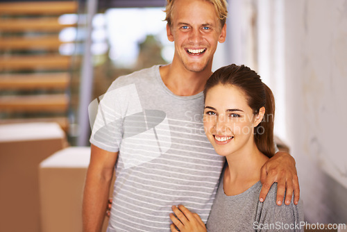 Image of Real estate, couple and portrait for property investment, new home and moving in hallway of house. Happiness, face of man and woman with hug for relocation, mortgage loan and cardboard boxes.