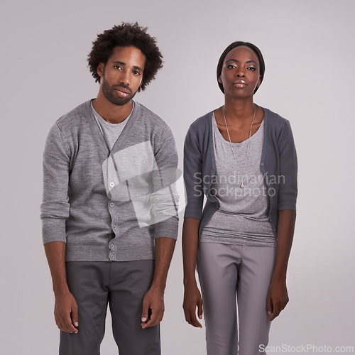 Image of Bored, tired and portrait of couple in studio with bad posture for anxiety, depression or lazy. Man, woman and face of moody people for burnout with grief, mental health or sad on gray background