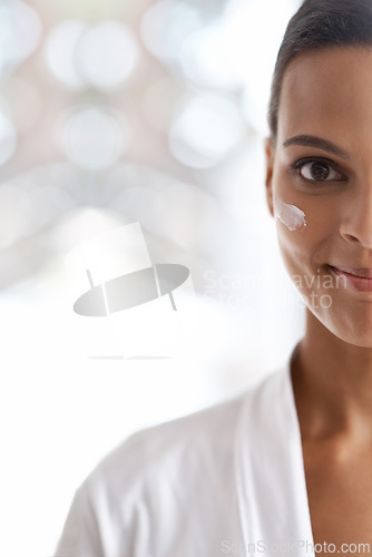 Image of Portrait, skincare and closeup of woman with lotion for dermatology, wellness or beauty in morning. Smile, moisturizer and face of person for cosmetics facial treatment and healthy skin in house.