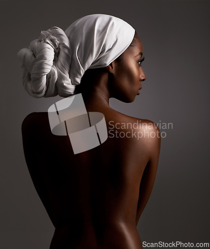 Image of Beauty, body and culture with natural black woman in studio on gray background for wellness. Skincare, heritage or tradition and aesthetic young model in Africa for cosmetics or dermatology from back