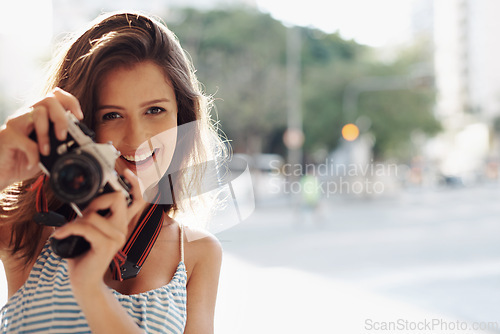 Image of Happy woman, portrait and photography with camera in city street for photo, memory or outdoor moment. Female person, tourist or photographer with smile or lens for picture or sightseeing in town