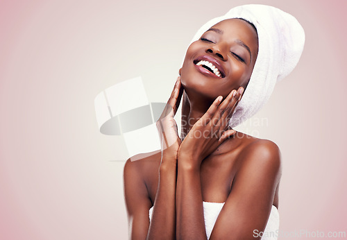 Image of Black woman, skin care and happy for beauty, studio and wellness in fresh look with smile and face touch. African female person, cosmetic, and aloe vera for anti age, nude and natural confidence