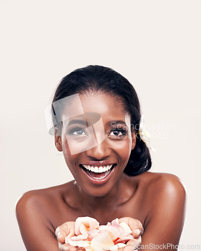 Image of Petal, skincare and black woman laugh in studio for makeup, beauty or wellness on white background. Floral, face and African model smile with soft cosmetics, shine or organic, fun and transformation