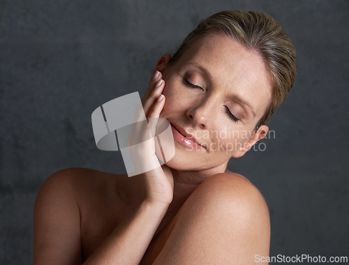 Image of Happy mature woman, studio and beauty, skin care and natural look in self love moment of thought. Old caucasian female person, face and dreaming in grey background, bodycare and naked confidence
