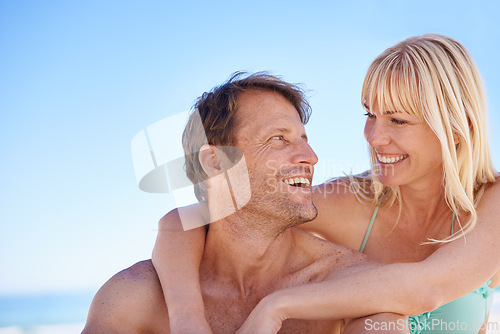 Image of Love, hug and happy couple at a beach with support, gratitude and bonding in nature together. Travel, face and people embrace at the ocean for adventure, romance and summer fun or holiday in Jakarta