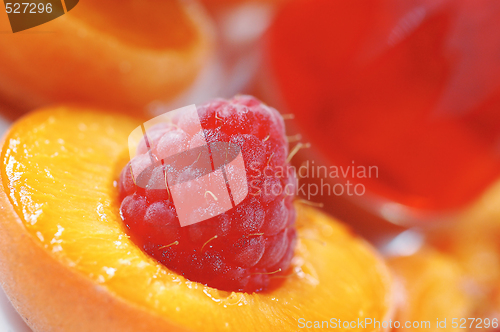 Image of Raspberry in halved peach