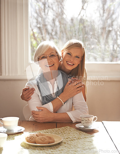 Image of Family home, retirement and daughter hug mom for breakfast in dining table, coffee and snacks. Female person, smile and happiness with mother in house, elderly and visit from girl, tea and biscuits