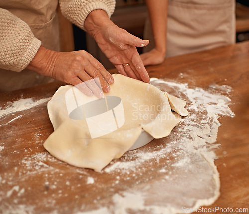 Image of Hands, flour and people baking in kitchen of home together closeup with ingredients for recipe. Cooking, food or dough with chef and baker in apartment for fresh pastry preparation from above