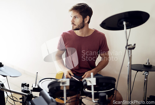Image of Drummer, man and music with percussion drums on stage, rhythm and talent with band. Creative person, practice and performing as artist or professional musician and audio entertainment on instrument