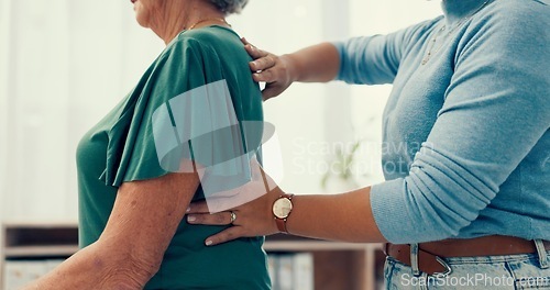 Image of Physiotherapy, hands and back pain with doctor for healthcare service, support and physical therapy in clinic office. Physiotherapist or chiropractor with senior woman or patient for a muscle massage