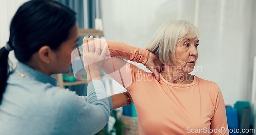 Image of Physiotherapy, stretching and senior woman in consultation for support, exam and helping with shoulder or muscle. Doctor, physiotherapist or nurse and elderly patient arm or elbow, check and service