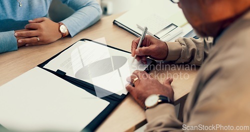 Image of Hands, lawyer or man with contract for signature, application and writing on document of insurance or legal paperwork. Attorney or notary with client for agreement of document, policy or title deed