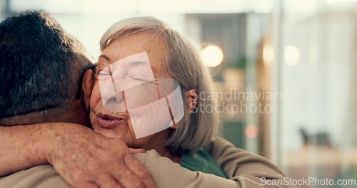 Image of Love, hug and an elderly couple in their home together for support, marriage or care with retirement. Relationship, smile or happy with a senior woman and old man embracing for romance in their house