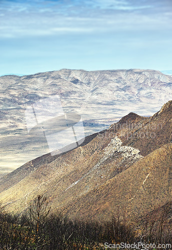 Image of Mountain, summit and natural landscape with blue sky, terrain and desert scenery for travel destination. Earth, nature and environment for countryside, outdoor adventure or explore in California.