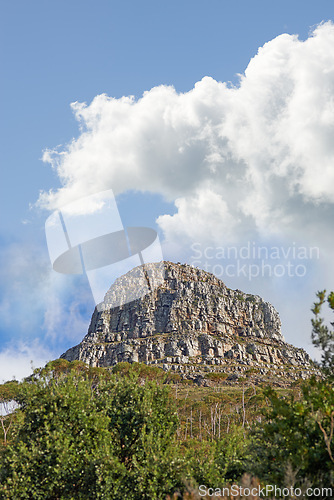 Image of Mountain, peak and natural landscape with cloudy sky, summer and serene hill with forest trees. Nature, tranquil cliff and sustainable environment with earth, travel and calm volcano on island