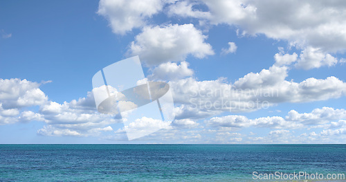 Image of Blue sky, ocean and clouds with horizon background for peace, nature and environment with skyline seascape of tropical beach. Calm water, sea and earth with location for break or vacation with view