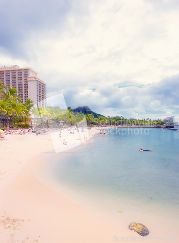 Image of Sand, ocean and beach in Hawaii city for tropical holiday, vacation and travel destination. Nature, island and seashore, waves and water in summer weekend for location, natural background and horizon