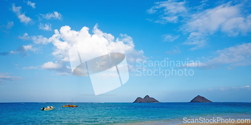 Image of Boat, ocean and landscape of beach in Hawaii for tropical holiday, vacation and travel destination. Nature, island and seashore, waves and water in summer weekend for location, background and horizon