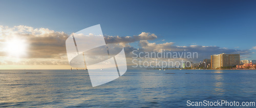 Image of Blue sky, ocean and clouds with city background for peace, nature and environment with skyline seascape of tropical beach. Calm water, sea and horizon with location for break or vacation with view