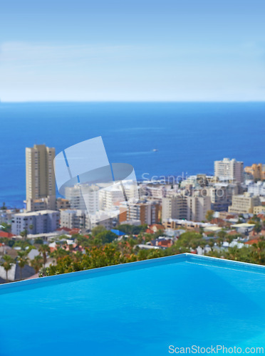 Image of Pool, city building and ocean outdoor for travel destination in summer for hotel swimming, infrastructure or downtown. Skyline, water and lodge accommodation in Cape Town or relax, trip or vacation