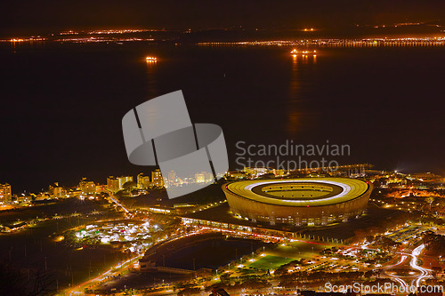 Image of Night, city and top view with travel and lights, architecture and skyscraper with outdoor landscape. Property, real estate and urban development, destination or location with skyline and background