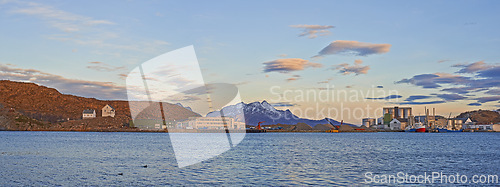 Image of Urban, sea and sky with clouds and mountains for harbor, landmark and destination for summer season. Bodoe, attraction or site for cityscape and travel on coast for scenic and vibrant getaway or view