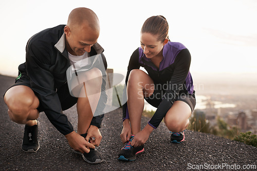 Image of Fitness, shoes and couple in a road for running, training or morning cardio run in nature together. Sneakers, shoelace and sports runner people outdoor for marathon, routine or performance workout