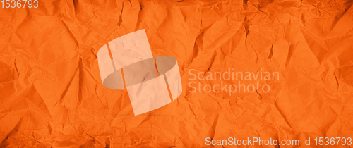 Image of Orange crumpled paper texture. Banner background
