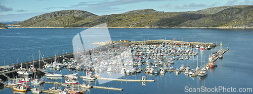 Image of Harbor, ship and marina in nature outdoors, travel and yacht on holiday or vacation and sail. Port, mountain and boat on water for peace or calm at dock, cruise transport and ocean or sea on island